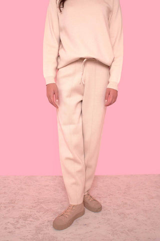 These athletic-inspired knitted pants are made from a wool and nylon blend, designed by L.F. Markey. The pants have an elastic waistband, large side pockets and a drawstring top. Style them with a casual crewneck sweatshirt or tee for a cool casual look.