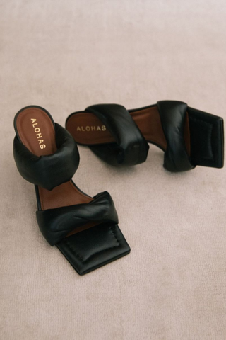 An open toe leather mule that will add a pop of fun to any day to night outfit. Simplicity at its finest with a mid-heel that makes this shoe style all the more special. Featuring a squared sole and padded fabric. Some days you just need a blank slate for a fresh start. Designed by Alohas, made in Spain. 