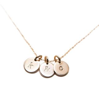 Made with 14K gold fill, hand stamped charms are our all-time-favourite gift for your bridesmaids, best friend, mom, sister, WHOEVER! The cutest way to wear something personal! Layer it up with additional initial gold charms, 14k gold chain also available online. Letters "A-Z" and "&" ampersand are available. If a letter is out of stock, we will gladly order it for you!