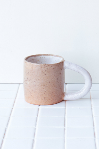 Bringing fresh shapes, cheerful details, and a vibrant wave of colour to any space, Nightshift Ceramic's mission is to make life a little brighter with fun ceramic housewares you can use everyday. The new everyday Colourblock Mug is finished in a clear glaze outside with a pop of colour inside. Available in both Rose and White! 