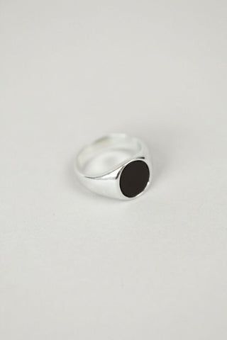 A sterling silver chunky bold ring designed by Wolf Circus. Featuring a classic onyx stone inlay round face, this silver ring is both handsome and elegant. Pair with more rings from Wolf Circus to capture that layered look. Size 9. 