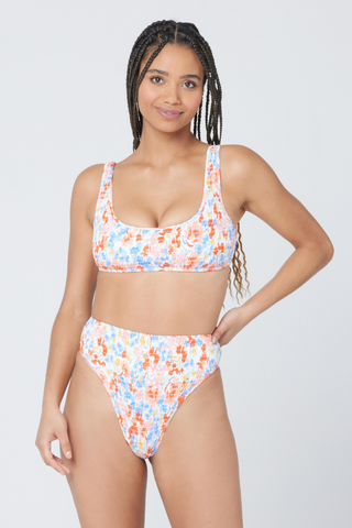 High-waist bikini bottom fans, rejoice! The Barlette Bottom is a new take on your favorite style, with flattering smocked fabric. A high-cut leg completes this wow-worthy look. L*Space's Flowers Forever limited printed is perfect for the swim season or your next beach vacation. 