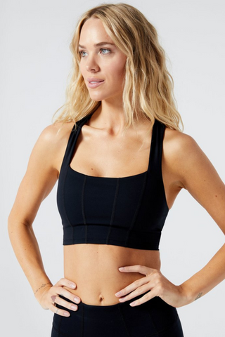 Our first ever line of activewear, designed by L*Space! Dominate your sweat sesh with the Beckham Black Bra Tank. A dynamic duo of double-lined, moisture-wicking nylon and spandex will keep things dry, comfortable, and everything in place no matter how hard you train. Features a comfy racerback and small back pocket.