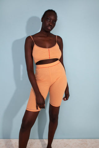 New for summer designed by L.F. Markey. The Hector Lounge Bralette features a fine ribbed pattern with a low scoop neck, thin adjustable straps and multi contrast stitching throughout. Made from 100% organic cotton, GOTS certified. Machine wash on a cool gentle cycle with similar colours. Worn with the Helios Bike Short