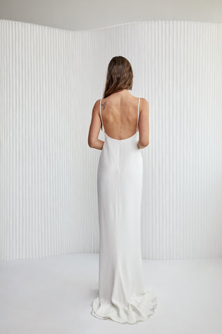 Special laid back sexy take to Slip dress! A luxurious Crepe silk gown, with fine silk straps, a v-neckline, ruched centre detailing, hi-lo hem to show off a shoe and a daring low back. Years in the making, it’s the perfect effortless silk silhouette for the modern woman.