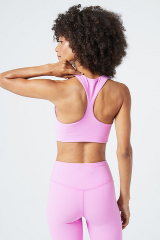 Our first ever activewear / lounge collection, designed by L*Space! Get your sweat on without the spillage in the Underdog Tank, a full coverage top. Crafted from soft ribbed fabric, it’s lightweight but can keep up with your most active workouts with a shelf bra, functional 3-snaps, and comfy racerback.