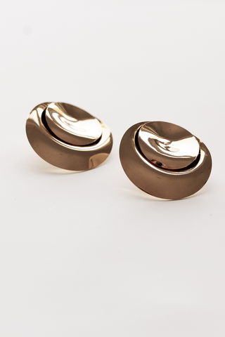 Statement bridal jewelry to elevate your look. These 14k gold plated laid back luxe gold studs by A. B. Ellie pair beautifully with a simple silhouette. 
