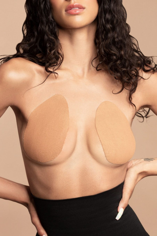 The Breast Lift Pads are the perfect backless and strapless solution to lift, shape, and support your breasts under any outfit. Made from 93% cotton they guarantee a very natural look & feel. Stretchy and breathable they feel like a second skin. The high quality and long-lasting adhesive make them sweat and water-proof.