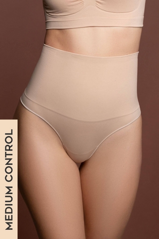 The Seamless High Waist Thong feels like second skin. With a medium core control high waist top and no stitching, this thong is flawless under almost anything! Designed by ByeBra, available in beige and black.