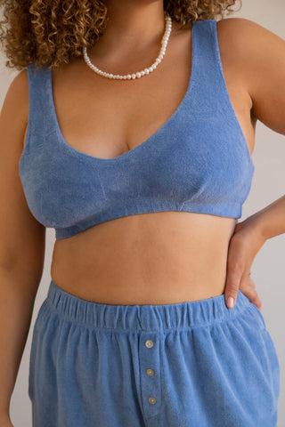 The Terry Bralette is the definition of lounge-lingerie. Layer underneath clothing or wear as is for a night out or your new WFH outfit. We promise this is the comfiest bra you will ever own, in a super soft terry made from a cotton blend. Pair with the matching shorts or sweatpants, designed by Donni. 