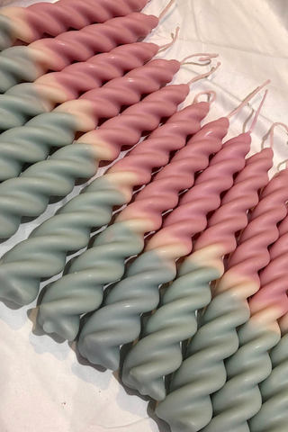 The Two-Tone Tapered Twirl candles are a 'twist' on the traditional tapered candle! This version is carefully made by Esh Candles through a series of dippings to create a two-tone effect of our favourite colour combinations. Made with soy wax, recycled cotton wicks, and non-toxic dyes. The twirls can fit into standard tapered candle holders, simply use a lighter or a blunt knife to soften the end, and twist the candles into place if you find they are too large for your holder.