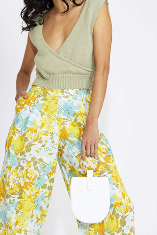 Super flattering and comfortable, this wide-leg pant is guaranteed to keep you airy + on-trend! The perfect high-waist pant to pack for your tropical honeymoon. Designed by Faithful featuring an exclusive handmade print made from 100% linen. 