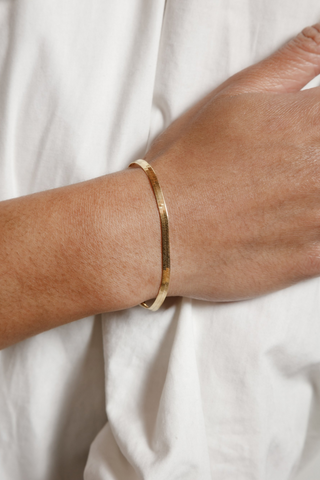 Designed by Wolf Circus. 7" 14k gold vermeil herringbone chain bracelet with lobster clasp. 