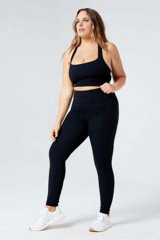 Kick some cardio butt with the Chase Legging. Crafted from breathable, moisture-wicking nylon spandex that works just as hard as you do. A flattering high waist smooths and refines, while stretchy, seamed fabric moves with your body so the only resistance you feel is your bands and weights. Includes a hidden waistband pocket perfect for keys. Designed by L*Space. 