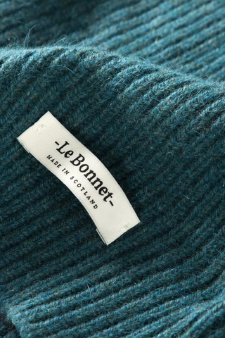 Introducing the best beanie ever made. Made from lambswool and Caregora in rich wine. This product features a Caregora certificate. The Caregora TM criteria of keeping and caring is founded on all these carefully judged guidelines, as to assure the quality of these valuable fibers and the highest standards of husbandry and animalcare. Sourced and manufactured in Scotland. Available in 11 fall hues. 