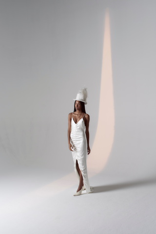 Special laid back sexy take to Slip dress! A luxurious Crepe silk gown, with fine silk straps, a v-neckline, ruched centre detailing, hi-lo hem to show off a shoe and a daring low back. Years in the making, it’s the perfect effortless silk silhouette for the modern woman.