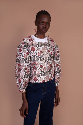 The floral design and intricate detailing of the Cypress Jacket are what dreams are made of. This cropped jacket features a straight, boxy cut, round collar and buttons down the front. We love the gathers at the shoulder and cuff that create an on-trend puffed sleeve. Designed by Meadows, made from a cotton blend. 