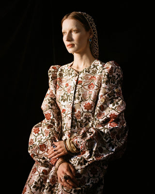 The floral design and intricate detailing of the Cypress Jacket are what dreams are made of. This cropped jacket features a straight, boxy cut, round collar and buttons down the front. We love the gathers at the shoulder and cuff that create an on-trend puffed sleeve. Designed by Meadows, made from a cotton blend. 