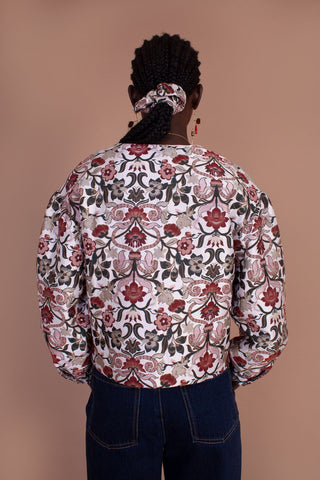 The floral design and intricate detailing of the Cypress Jacket are what dreams are made of. This cropped jacket features a straight, boxy cut, round collar and buttons down the front. We love the gathers at the shoulder and cuff that create an on-trend puffed sleeve. Designed by Meadows, made from a cotton blend. 