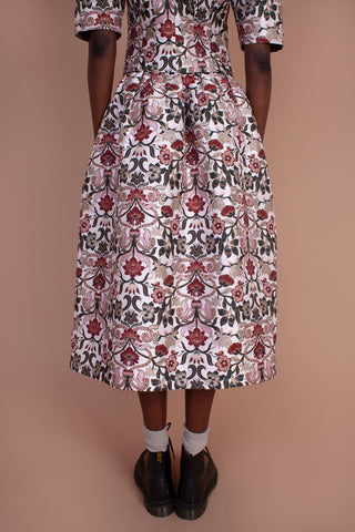 The floral design and intricate detailing of the Orchid Skirt are what dreams are made of. This knee length skirt features a mid-high waist. In Meadows limited edition Tudor Jacquard fabric with pockets. Designed by Meadows, made from a cotton blend. 
