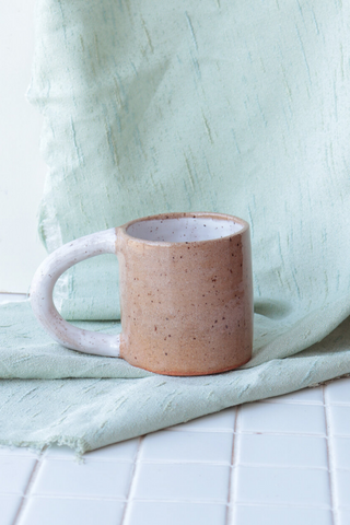 Bringing fresh shapes, cheerful details, and a vibrant wave of colour to any space, Nightshift Ceramic's mission is to make life a little brighter with fun ceramic housewares you can use everyday. The new everyday Colourblock Mug is finished in a clear glaze outside with a pop of colour inside. Available in both Rose and White! 