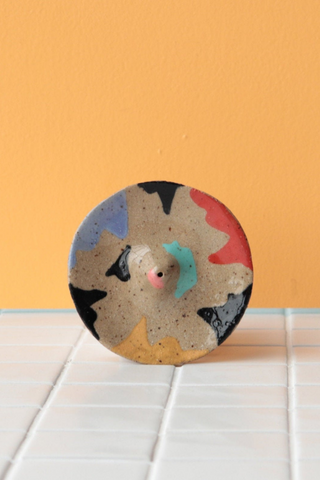 This one-of-a-kind ceramic incense holder is both modern and minimalist. Hand formed from speckled stoneware, decorated with rich, colourful pattern and clear glaze. Made locally in Toronto, Canada.   Bringing fresh shapes, cheerful details, and a vibrant wave of colour to any space, Nightshift Ceramic's mission is to make life a little brighter with fun ceramic housewares you can use everyday.