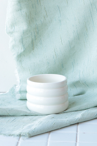 We are obsessed with this new one-of-a-kind ceramic planter by Nightshift Ceramics. This bright white porcelain planter us perfect for a small cactus or succulent. They have nicknamed this the marshmallow planter because it really looks like one! No two will be alike! There is a small hole in bottom of pot for water drainage. 