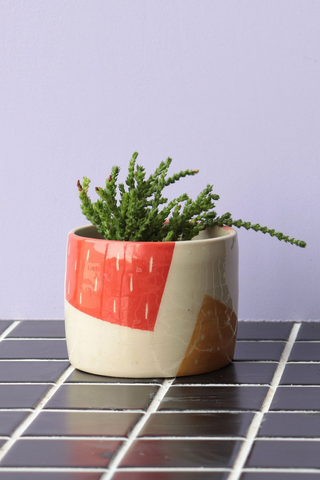  Bringing fresh shapes, cheerful details, and a vibrant wave of colour to any space, Nightshift Ceramic's mission is to make life a little brighter with fun ceramic housewares you can use everyday. This small planter features bold, geometric blocks of colour, perfectly sized for a small succulent, plants, or a cactus. Wheel thrown, ceramic stoneware with hand carved details. Small hole in bottom of pot for water drainage. Locally made in Toronto, Canada. 