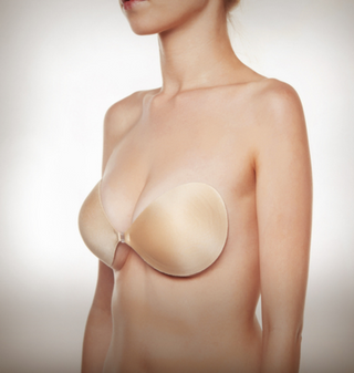 A staple at LoversLand and the perfect bra for all dresses and tops that require no straps and a little extra cleavage. The Adhesive Seamless Nubra features a lightweight fabric with seamless edges, made with skin-friendly and reusable adhesive that easily sticks onto the skin without losing grip. The front closure help to provide cleavage control. Made in USA.