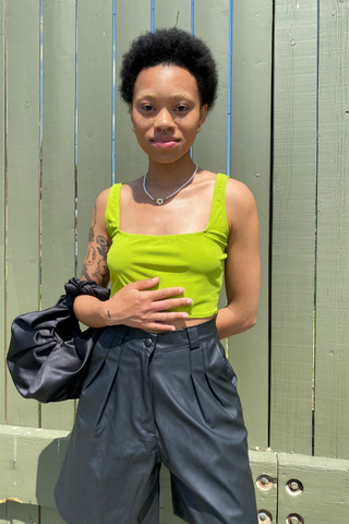 A statement piece for your next summer outing. Elevate your shorts game with the Bermuda Short featuring a high waist and casual pleats made from a polyblend faux leather. This is a classic look designed by Pastiche in black - perfect for any summer or holiday wardrobe. 