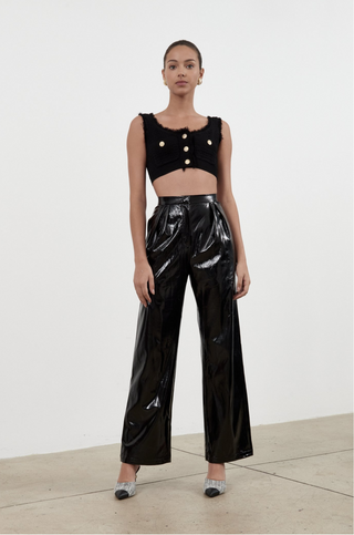 Torn between fashion and comfort? Well, that's exactly the point. The Dina Pant by Ronny Kobo features wide legs and a high waist made from faux patent leather. The perfect pant for your first night out! 