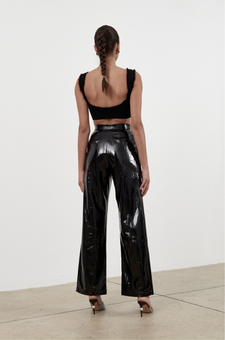 Torn between fashion and comfort? Well, that's exactly the point. The Dina Pant by Ronny Kobo features wide legs and a high waist made from faux patent leather. The perfect pant for your first night out! 