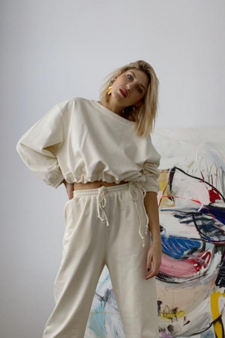 One sweatshirt – two silhouettes. Featuring Soft Focus's signature open neckline, effortless drop shoulder silhouette + ruched, elastic cuffs, The Scrunch Sweatshirt can be worn loose or cinch it in using the drawcord ties at the hem. Keep it breezy or bring in the volume – you decide. The cropped length hits below the natural waist + works perfectly with the high-rise Breeze Sweatpant for a chic sweatsuit look. Also available in Graphite + Sea Breeze.