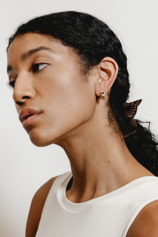 Funky, elegant, and bold - we are loving the Esther Face earrings designed by Wolf Circus. Featuring a 14k gold plated bronze stud earrings with asymmetrical faces. All metals are made from recycled materials, making the these stud gold earrings our favourite eco-friendly option. 