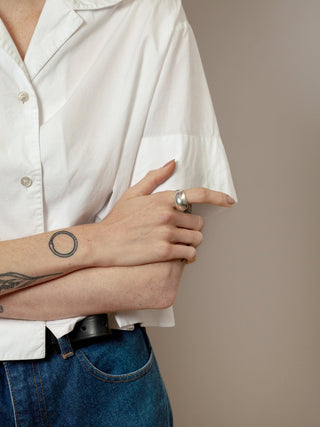 A sterling silver classic ring designed by Wolf Circus. The Fera is a stunning classic bulb ring that is minimal and clean in style. Pair with more rings from Wolf Circus to capture that layered look. Size 7. 