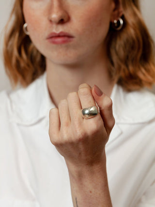 A sterling silver classic ring designed by Wolf Circus. The Fera is a stunning classic bulb ring that is minimal and clean in style. Pair with more rings from Wolf Circus to capture that layered look. Size 7. 