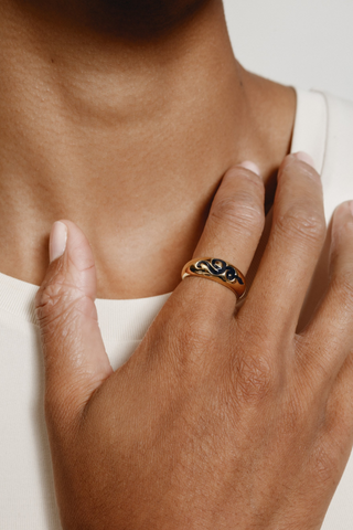 A 14k gold plated classic ring designed by Wolf Circus. The Memphis ring features a gold-plated bronze ring with a navy snake detailing. Pair with more rings from Wolf Circus to capture that layered look. The Memphis Ring is the perfect statement ring to keep your look stacked.