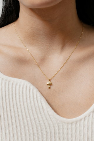 Designed by Wolf Circus. The funky Mushroom Charm Necklace is 18" in length, with a 14k gold plated bronze on gold-filled singapore chain. Made in Vancouver, Canada. 