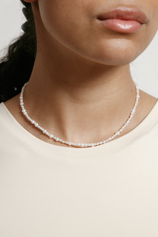 Designed by Wolf Circus. The Renata 16" small freshwater pearl necklace is gold filled featuring a lobster clasp. Made in Vancouver, Canada. Designed by Wolf Circus. The Renata 16" small freshwater pearl necklace is gold filled featuring a lobster clasp. Made in Vancouver, Canada. 