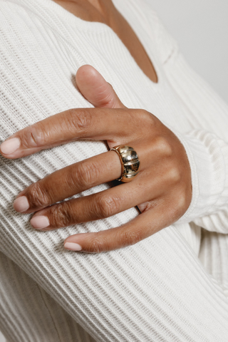 A plated sterling silver gold ring designed by Wolf Circus. The Imogen ring features an on-trend textured design. Pair with more rings from Wolf Circus to capture that layered look. The Imogen Ring is the perfect statement ring to keep your look stacked.